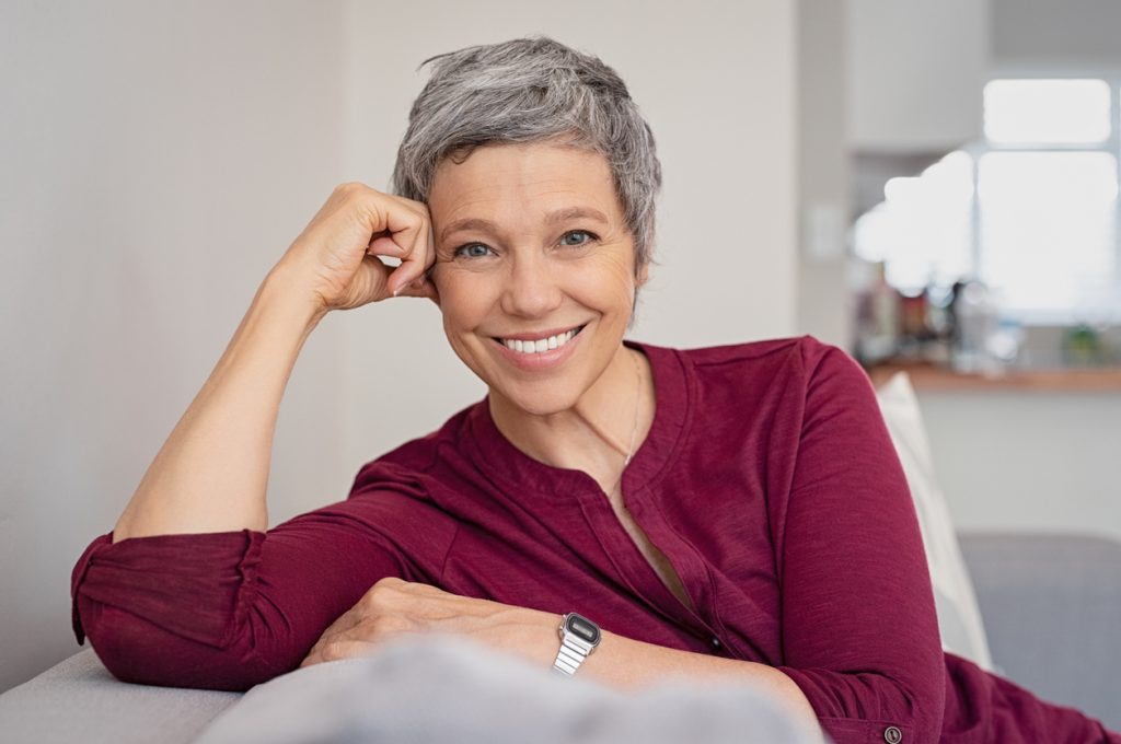 woman with short grey hair smiling